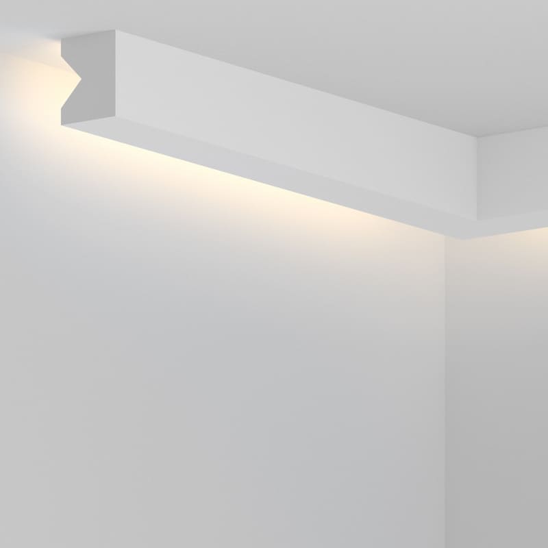 Moldura decorativa blanca de techo con iluminación LED indirecta en esquina de pared.